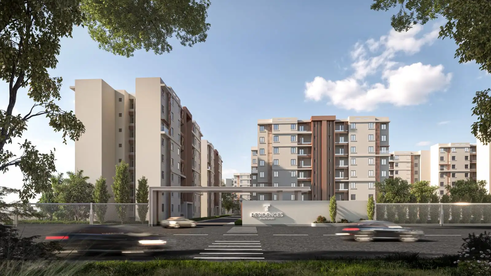 Wide view of the residential buildings and green spine at T Residences New Alamein