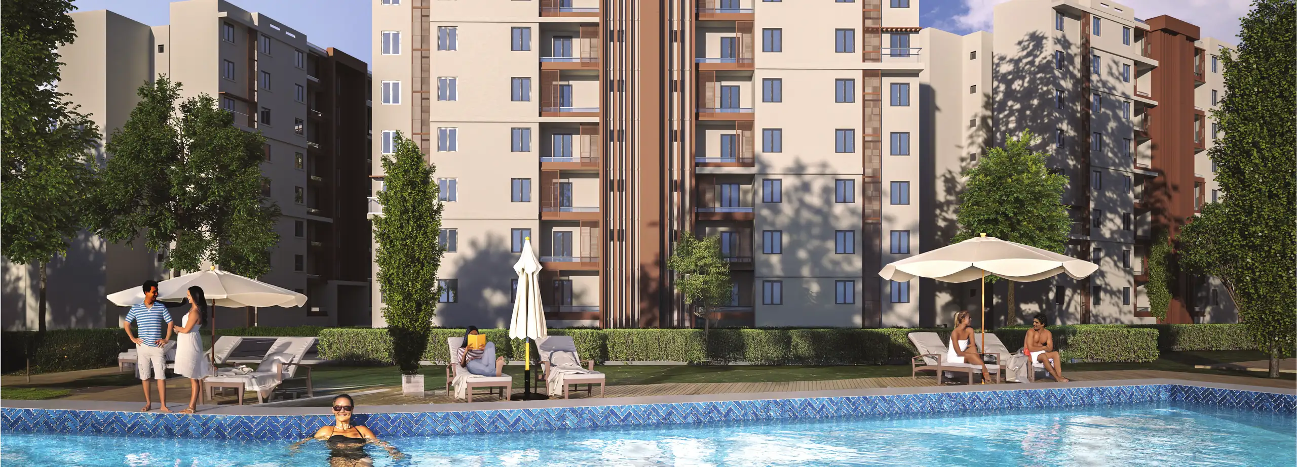 Pool, umbrellas and residential facades at T Residences New Alamein