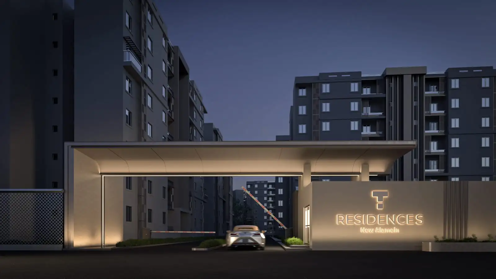 The entrance gate at T Residences New Alamein after dark
